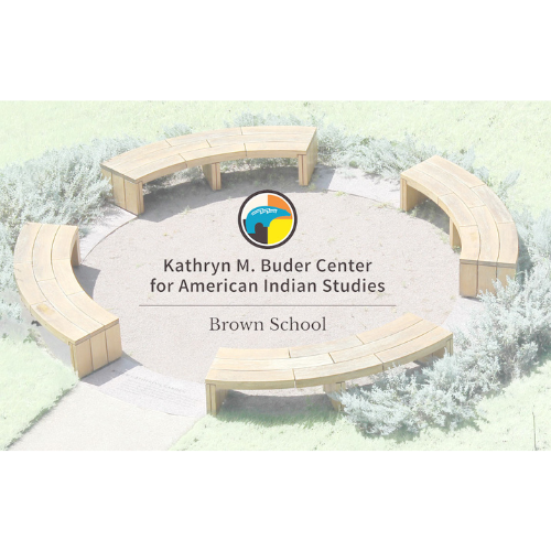 Image of the Buder Center Logo. Image is four wooden benches in a circle on concreate with green shrubbery behind the benches. There is a circle in the center outlined in black with orange, blue, white, black and yellow color blocks interweaving on it, and the words under it read, "Kathryn M. Buder Center for American Indian Studies. Brown School."