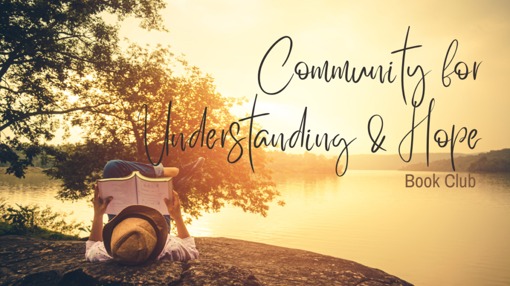The image shows a person on a shoreline at sunset reading a book. The person has a straw hat on and blue jeans with a white shirt. There is a large tree in the background. The words read, "Community for Understanding & Hope Book Club"